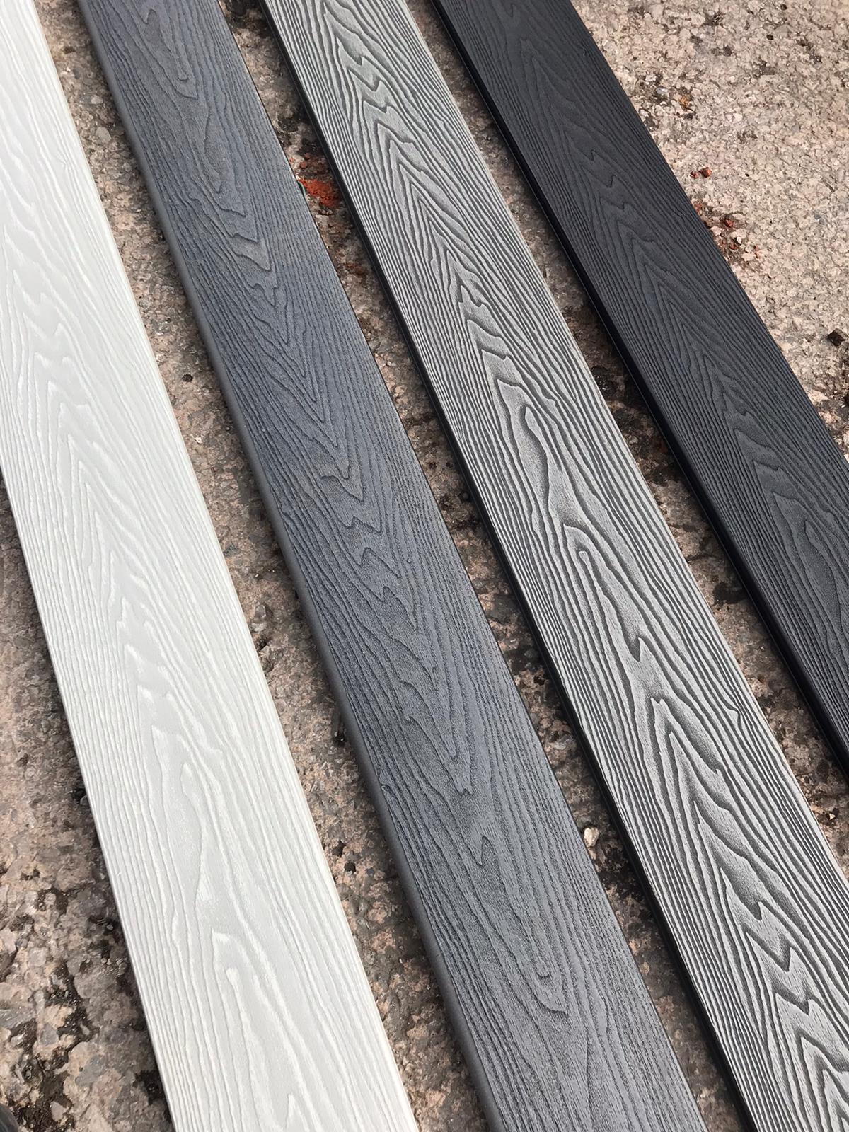 A selection of The Grass Yards grey composite decking.