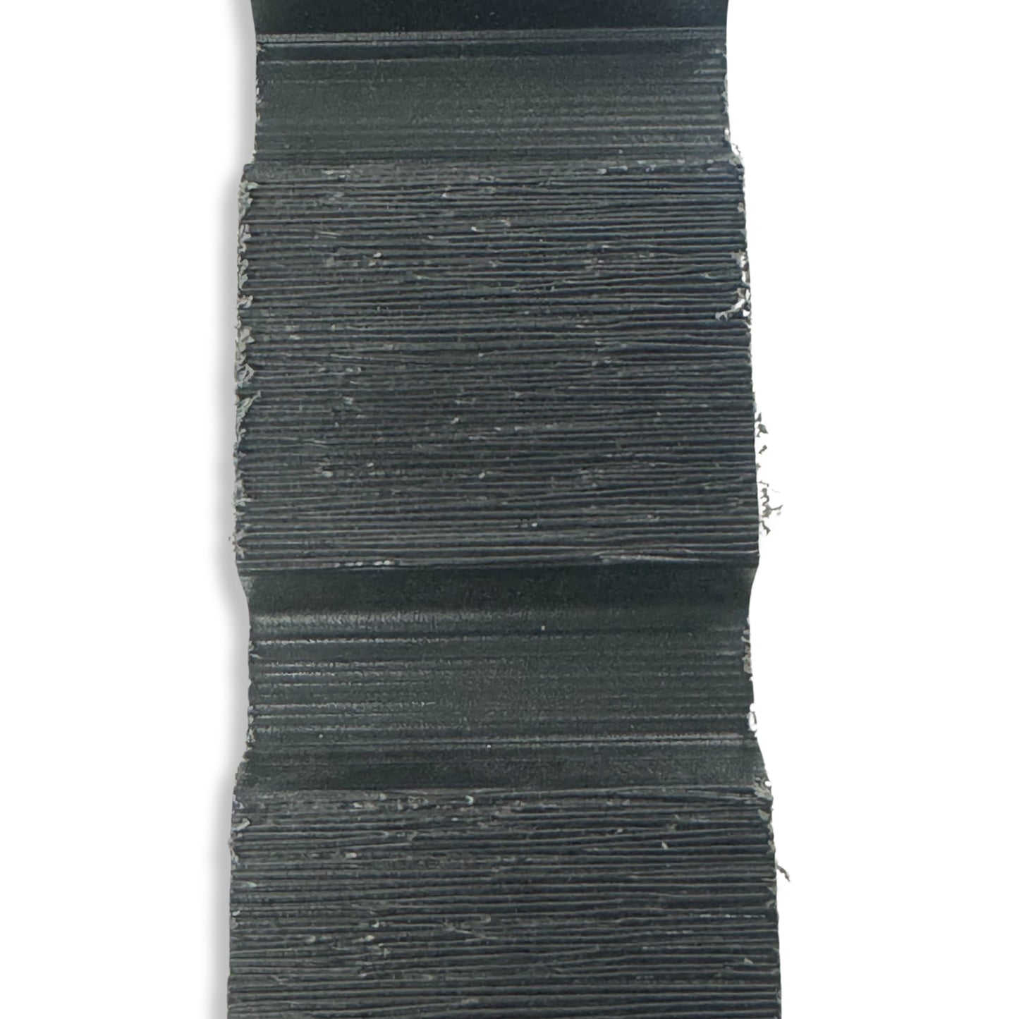 A sample size bit of anthracite composite slatted fence board.