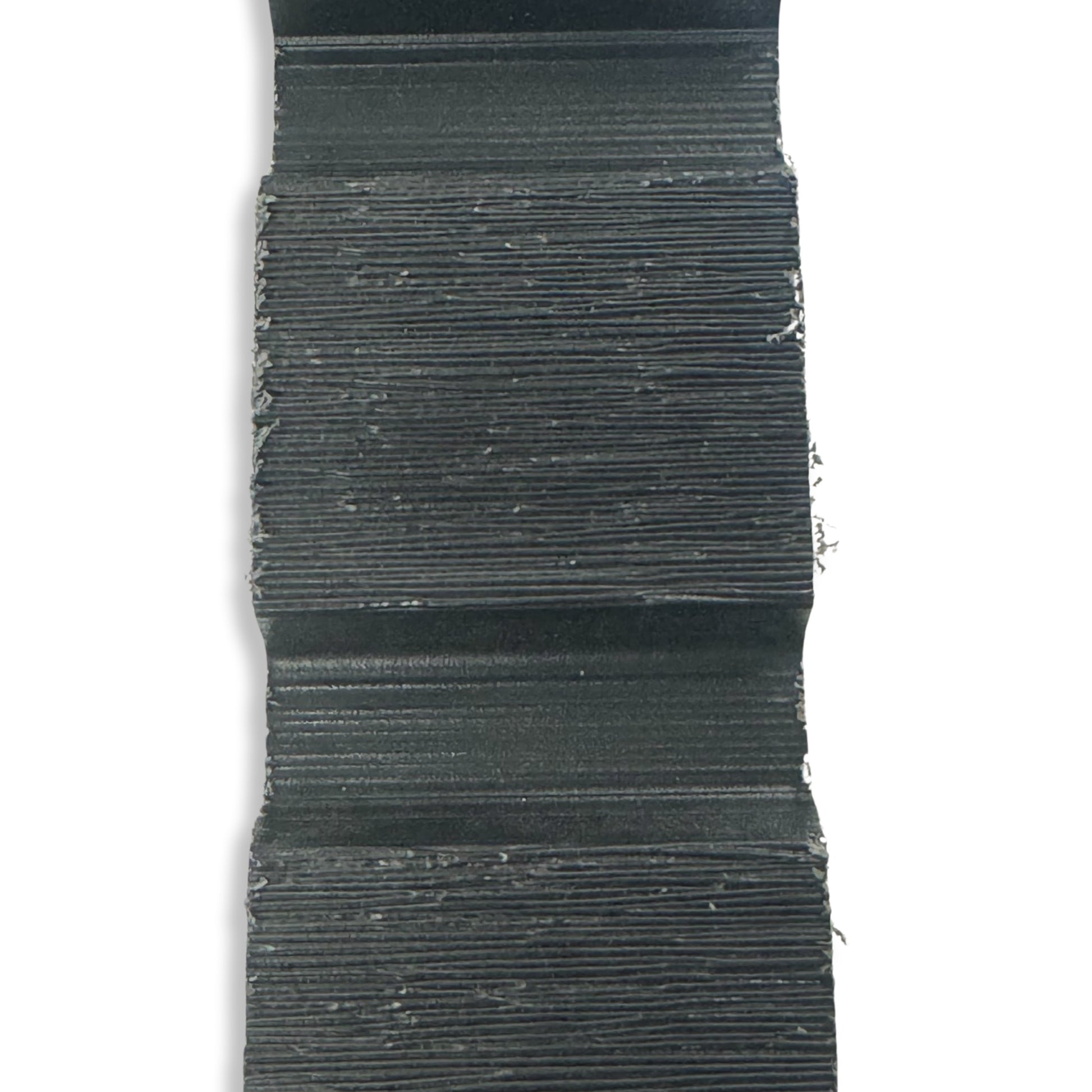 A sample size bit of anthracite composite slatted fence board.