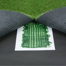 A small section of artificial fake grass laid out ready to be joined with fake grass seem tape and artificial grass adhesive.