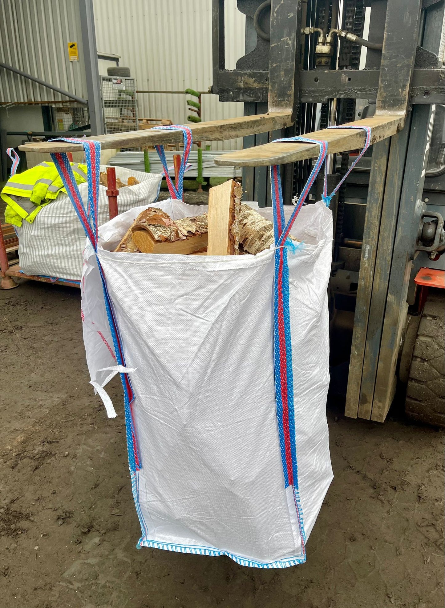 A full white tote bag of kiln dried silver Birch Firewood logs for delivery to Glasgow.