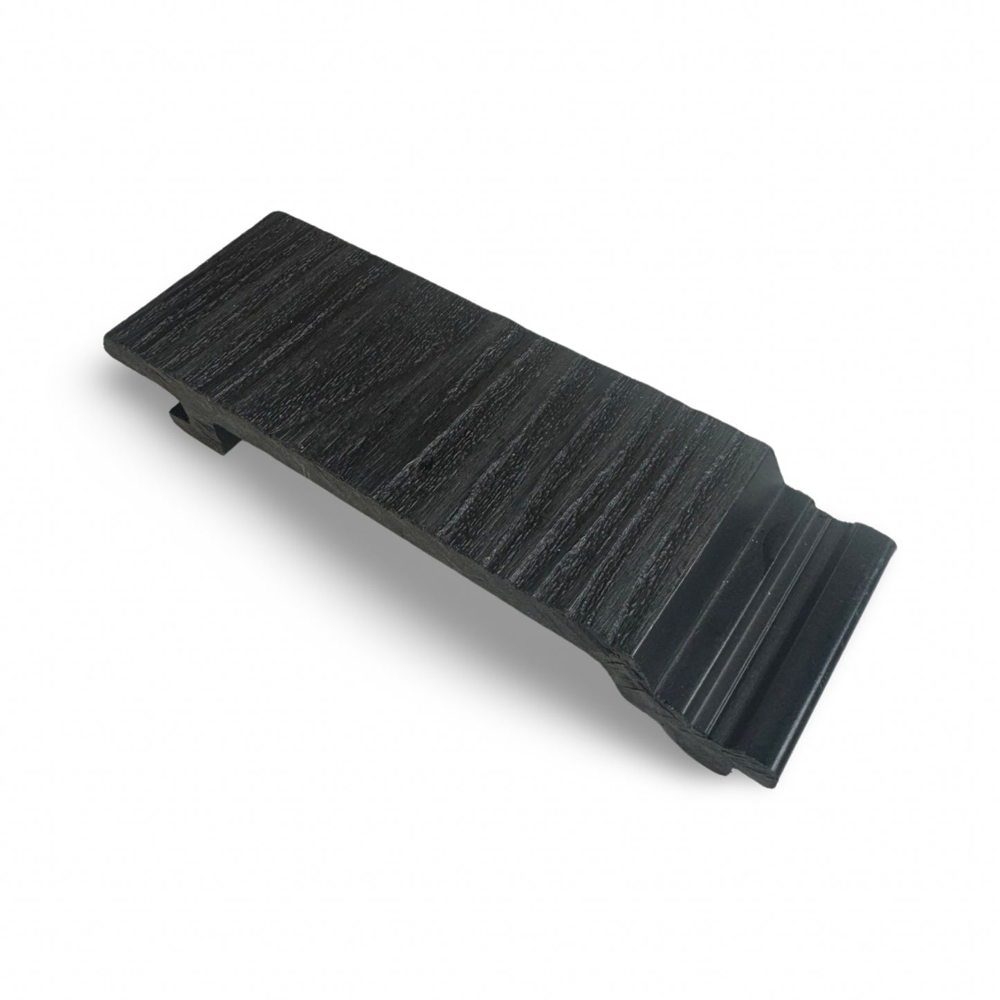 A sample size of charcoal black woodgrain shiplap composite cladding.