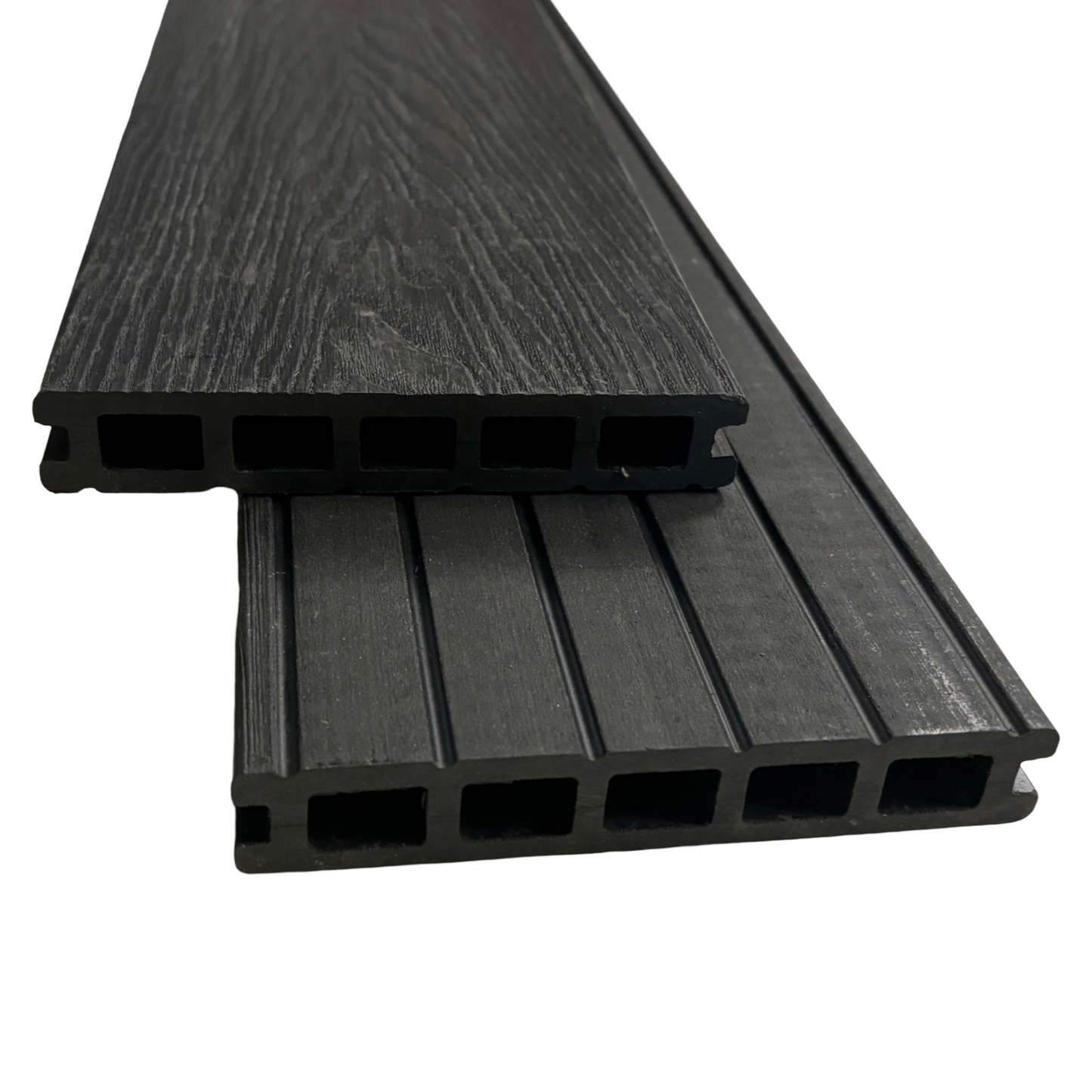 Two black charcoal composite decking boards showing the end profile, wood grain and both sides of the boards.