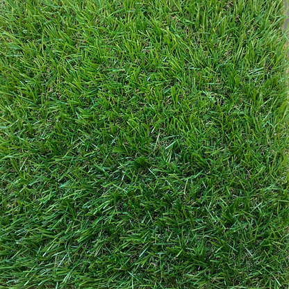 Coll 30mm pile budget artificial grass photographed from above showing the light coloured green fake grass blades.