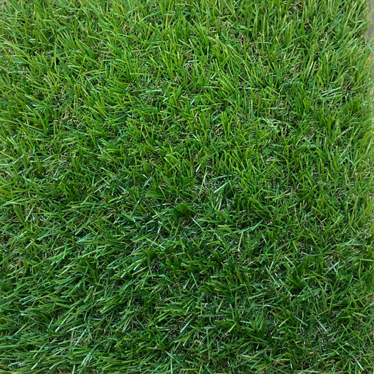 Coll 30mm budget artificial grass pictured from above showing a natural light green fake lawn grass.