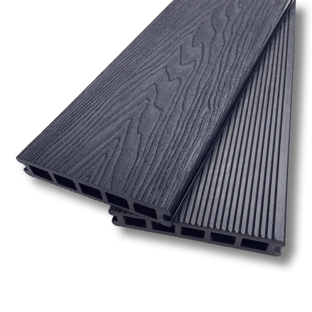 A dark grey composite decking board showing the wood grain and end profile