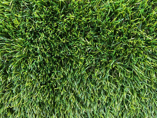 A close up picture of Durness 32mm fake grass blades dark, deep green artificial grass blades.