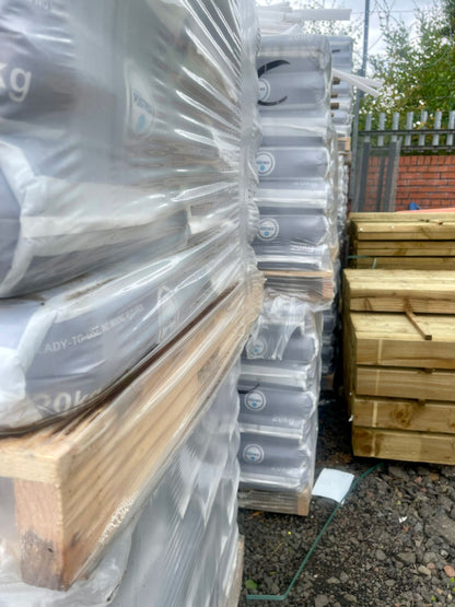 Pallets of ready mixed fence post concrete from The Grass Yard.