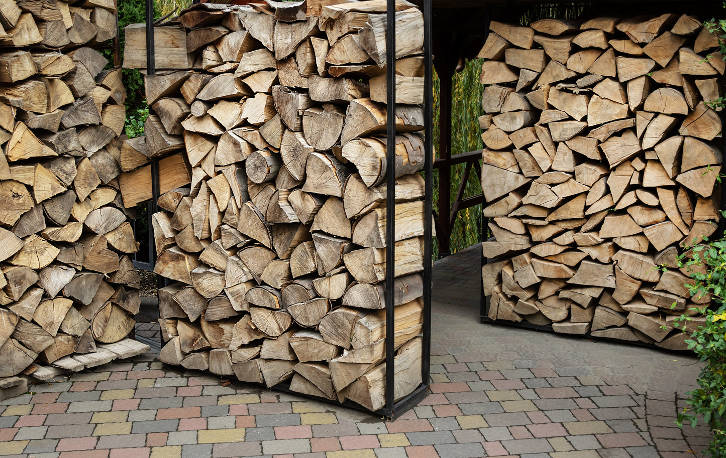 Log stores fully stacked with firewood.