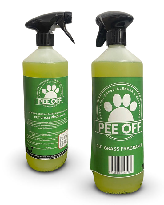 A green and white spray bottle of PEE OFF artificial grass cleaner with a cut grass fragrance.