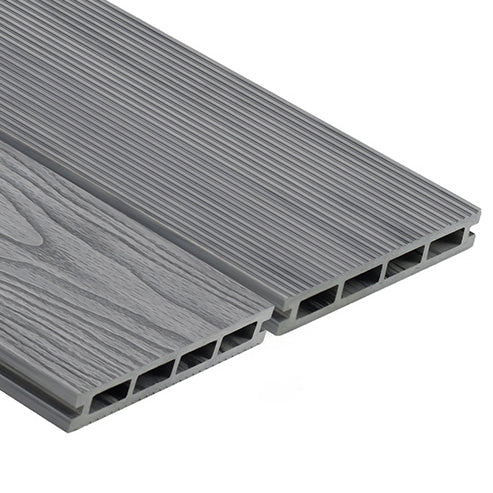 A modern composite decking installation with grey wood-like appearance.