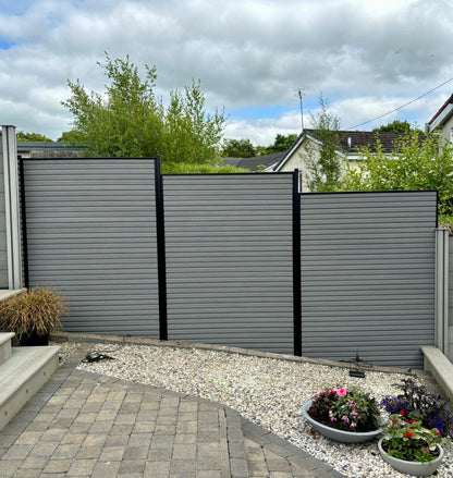 A steel grey composite slat fence with black metal posts in Glasgow.