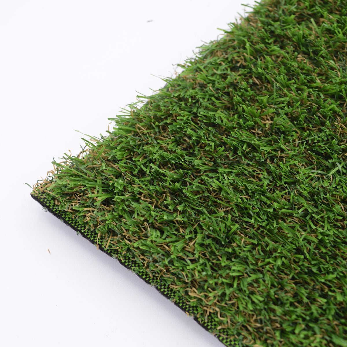 Close-up of artificial grass with a white background