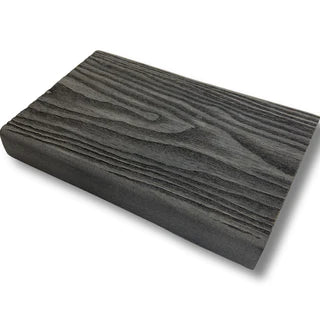 A side profile picture of a composite decking bullnose board in steel grey showing the wood grain.