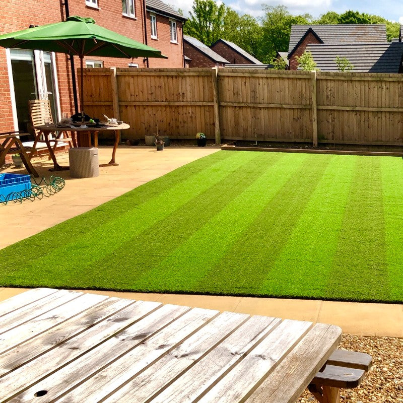 Striped artificial grass in a uk garden