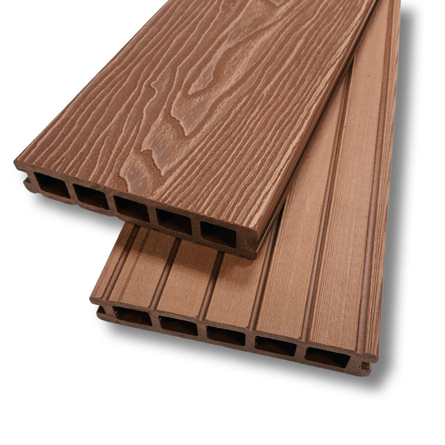 A picture of a Teak composite decking board showing the end profile and wood grain.