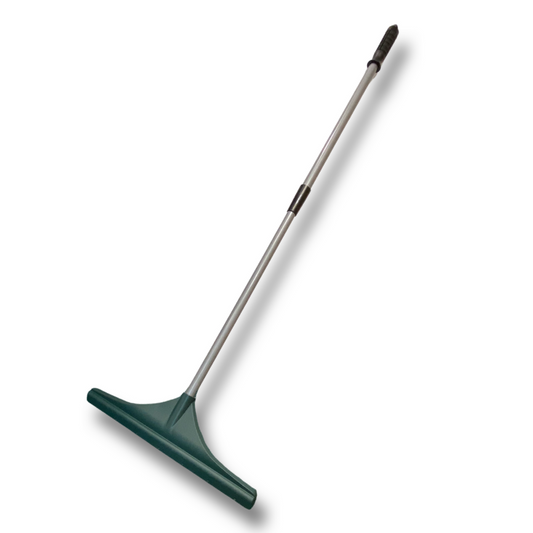 A picture of a green and silver artificial grass brush or rake.